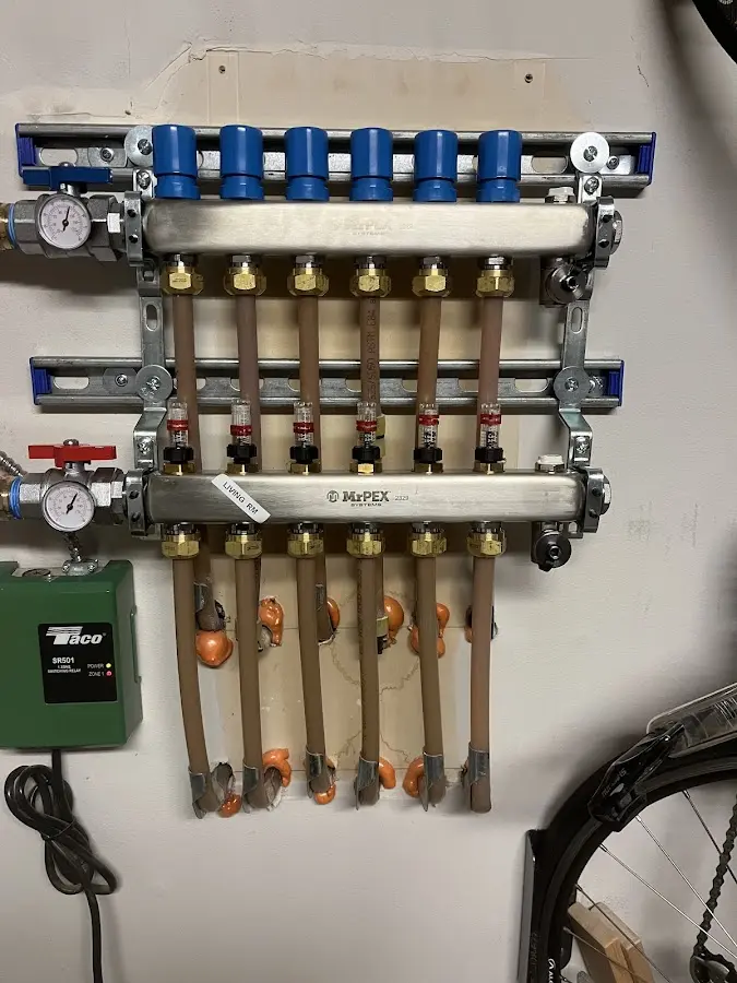 Plumber performing Gas Line Installation at a residential property in Champlain