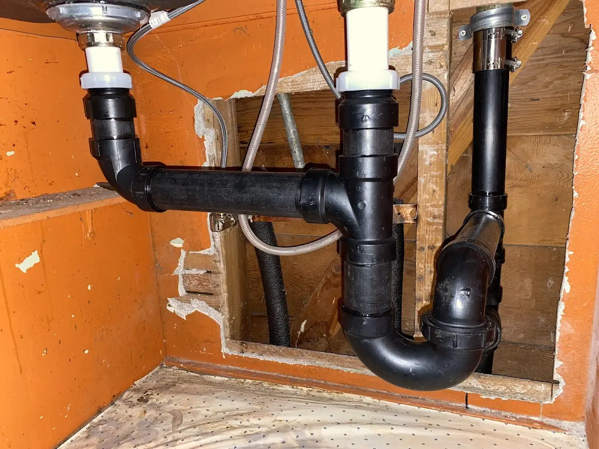 Professional Garbage Disposal Repair equipment and tools on the job in Champlain